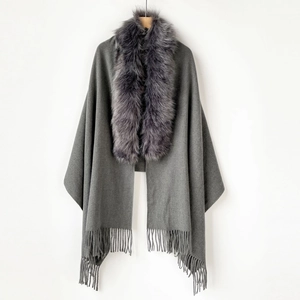 Detail of dark grey shawl with plush faux fur collar and elegant long fringe trim
