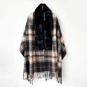 Detail of elegant plaid shawl featuring premium faux fur collar and fringe tassels