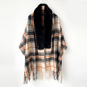 Close-up of black faux fur collar on beige plaid shawl with orange and black stripes
