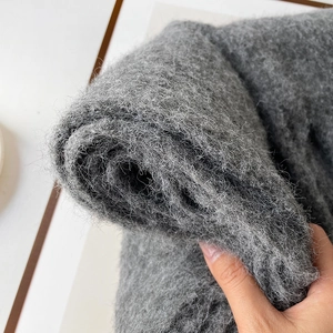 Close-up detail of grey mohair wool scarf showing soft long-piled fluffy texture