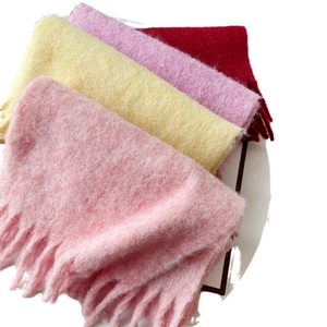 Solid color mohair scarves in pink, yellow, purple and red with long tassel edges