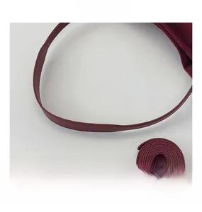 Detailed view of the dark burgundy leather handle with smooth oil-edge craftsmanship