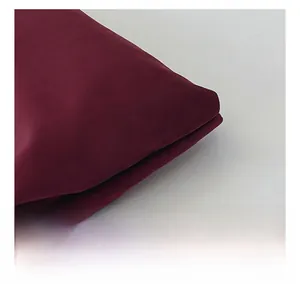 Detailed macro view of the soft matte burgundy fabric texture on this Boston bag