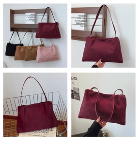 Detail view of suede Boston bags in multiple colors like burgundy and dark brown