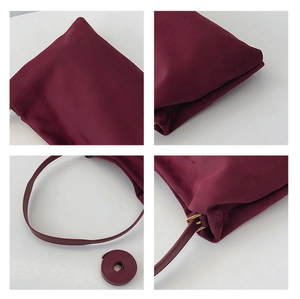 Detailed views of burgundy suede Boston bag featuring matte gold hardware and dual straps