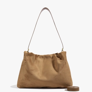 Detailed macro view of the brown suede textured Boston bag with vintage metal parts