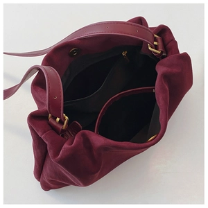 Internal structure of burgundy Boston bag with zippered pocket and magnetic closure