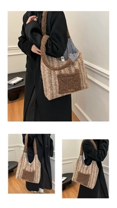 Detailed close-up showing plush striped tote bag texture and interior blue plaid lining