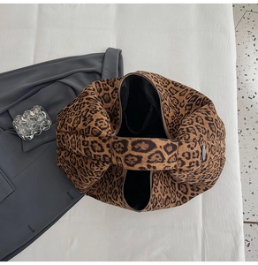 Detailed top view of a large leopard print tote bag with quilted texture and soft lining