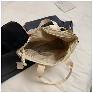 Top view of spacious tote bag interior with zipper closure and durable strap details