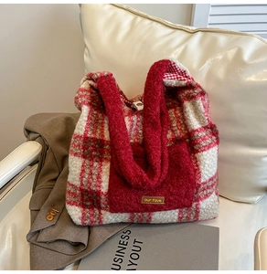 Detail of red checkered plush tote bag with our fave leather label and soft inner lining