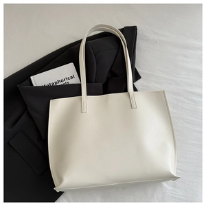 Minimalist cream white tote bag in smooth faux leather with matching thin shoulder straps