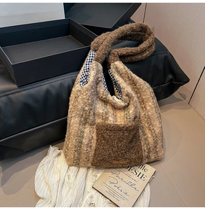 Detail of plush tote bag with brown vertical stripes, contrast pocket and plaid lining