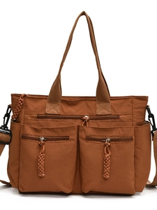 Brown multi-pocket nylon tote bag with top handle and adjustable shoulder strap for women