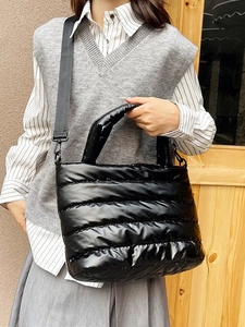 Stylish black quilted puffer tote bag for women with adjustable wide shoulder strap