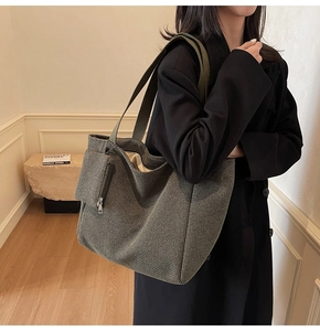Large houndstooth woven tote bag with matching zippered pouch for daily commuting