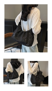 Detailed view of black nylon crossbody bag with starry texture and drawstring closure