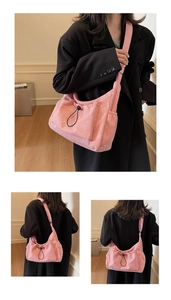 Detail of pink corduroy tote bag with silver glitter and adjustable drawstring side pocket