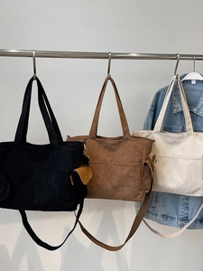 Three colors of large capacity corduroy tote bags shown in a lifestyle fashion setting