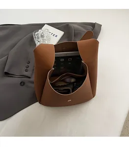 Interior view showing spacious capacity of a vintage matte brown crossbody bag for daily items