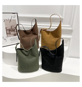 Collection of minimalist suede bucket bags in coffee, yellow, olive, and black colors