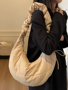 Chic beige quilted down dumpling shoulder bag with stylish ruched straps for women