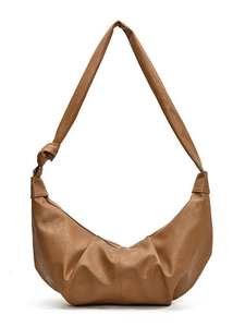 Brown faux leather crescent shoulder bag with pleated texture and knotted strap detail