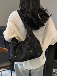 Black star print pleated nylon crossbody bag with large capacity and drawstring detail