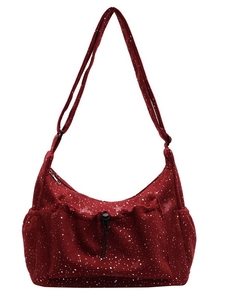 Fashionable burgundy corduroy crossbody bag with silver star pattern and large front pocket