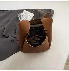 Detail view of large interior capacity of the matte brown leather tote bag