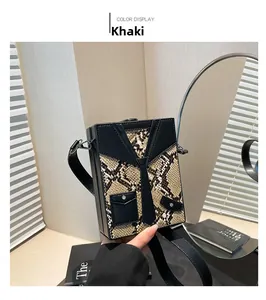 Detail view of khaki crossbody bag with snake print texture and creative tie design