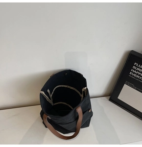 Top view of large canvas tote bag showing inner pockets and snap closure details