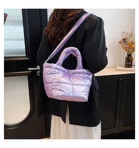 Close-up of lavender quilted down tote bag with metallic finish and thick handles