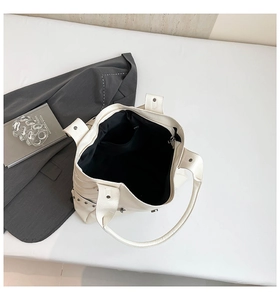 Detailed top view of the spacious white PU leather tote bag with functional inner zipper pocket