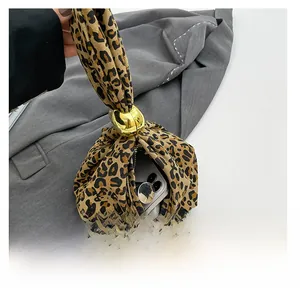 Zebra pattern handbag interior detail showing large capacity with a smartphone inside