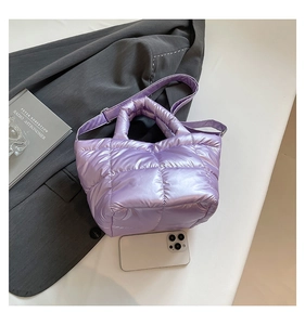Top view of metallic lilac quilted puffer tote bag with adjustable shoulder strap