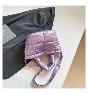 Macro shot of purple quilted down tote bag with satin finish and detailed stitching