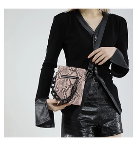 Pink snakeskin pattern box bag featuring a chunky black chain and crossbody strap details