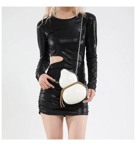 Detailed view of white gourd-shaped crossbody bag with woven rope and chain strap