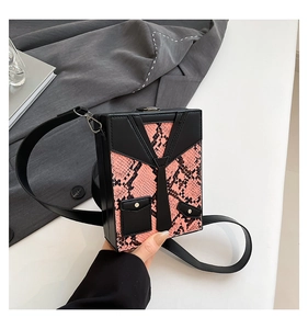 Detail of creative pink snake print hard case crossbody bag with tuxedo vest design