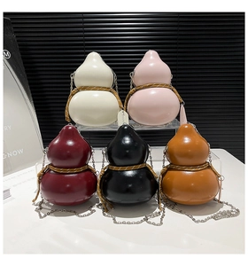 Detailed display of gourd shaped crossbody bags in five glossy colors with chain straps