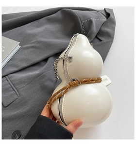Detail of cream gourd-shaped crossbody bag with smooth PU leather and braided rope accent