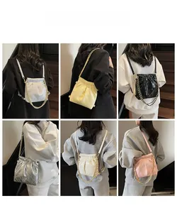 Quilted cloud bucket bags with metal chains shown in six colors on models
