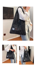 Detail of dark grey denim tote bag with white contrast stitching and a front utility pocket