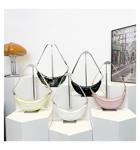 Collection of nylon crescent crossbody bags in camouflage, black, beige, white, and pink