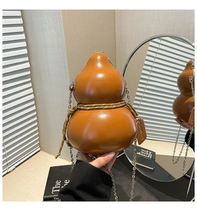 Detailed view of brown gourd-shaped crossbody bag with decorative rope and metal chain strap