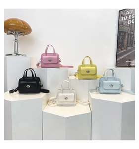 Minimalist square tote bags in five colors with silver swivel locks and long straps