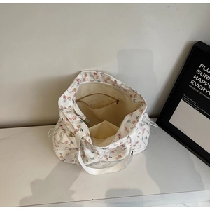 Detail view of the spacious inner lining with zipper pocket on floral tote bag