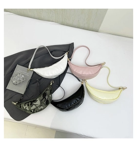 Detailed top view of dumpling-shaped crossbody bags in five colors with nylon texture