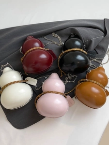 Unique gourd-shaped crossbody bags in multiple colors with metallic chain straps
